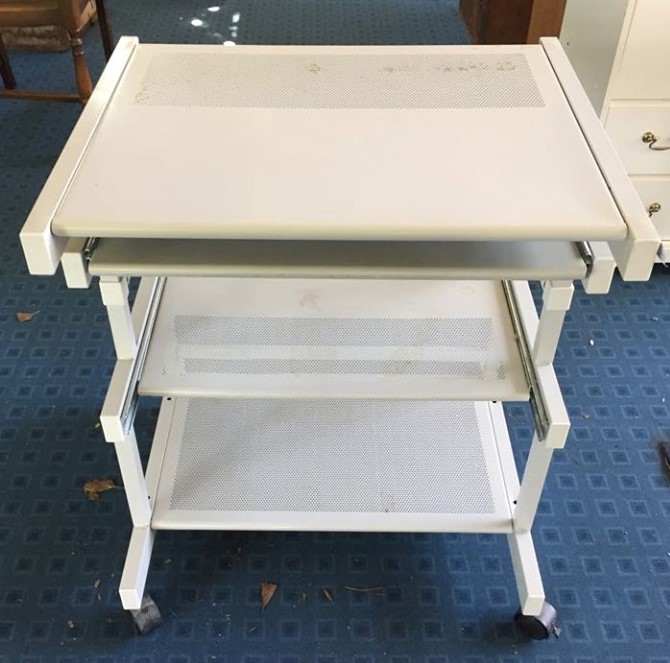 Metal desk on wheels with pull-out shelf for keyboard. 635mm Wide x 485mm deep x 740mm tall to work surface.