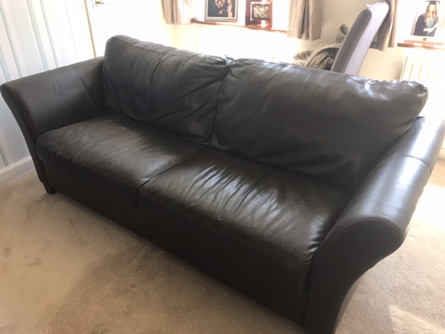 Large 3 seater brown leather sofa.