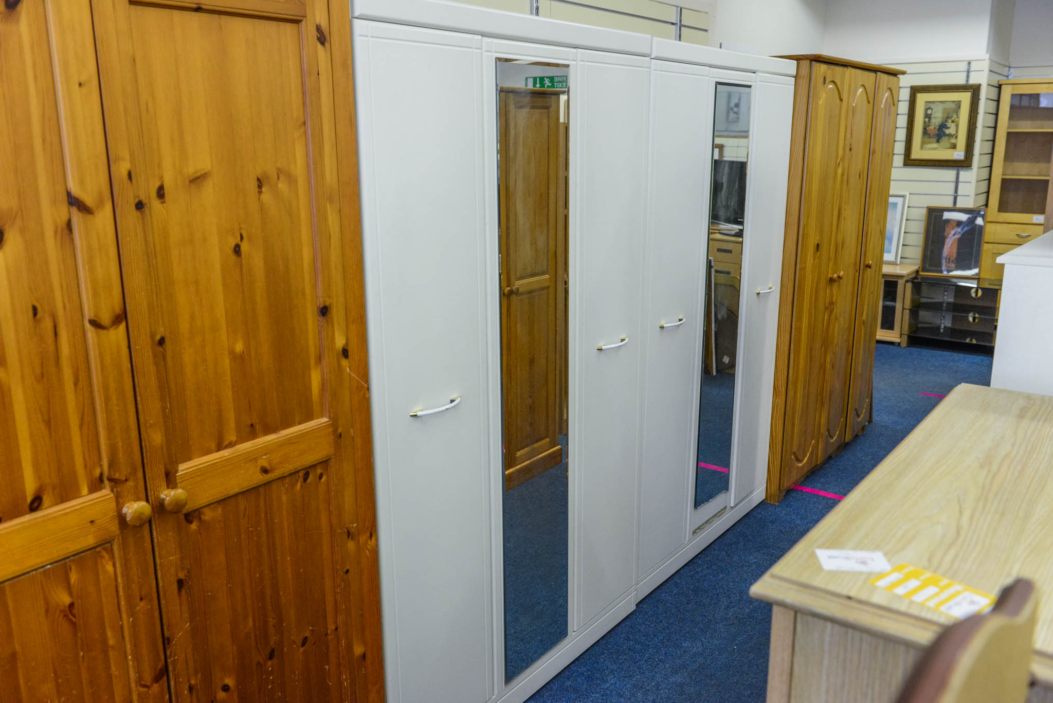 Large white wardrobe
Dimensions:
44 1/2" or 113cm wide
72" or 183cm tall
Has slight damage to bottom of mirror.