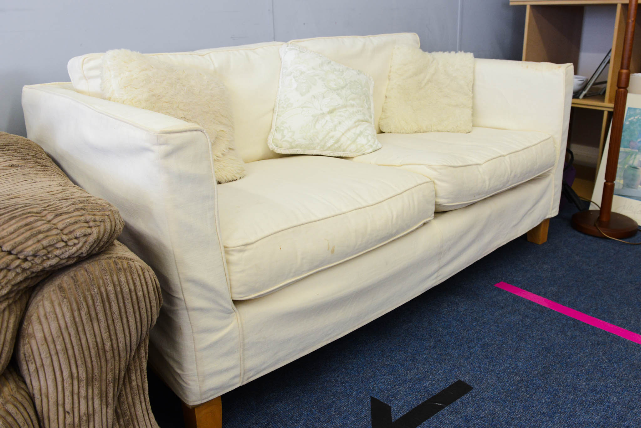 Large two seater sofa with removable covers in off white. Easy to launder or dye to change colour