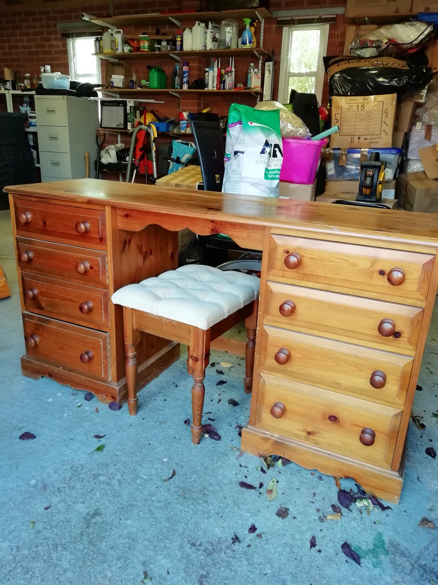 Large desk made of pine with drawers at each end