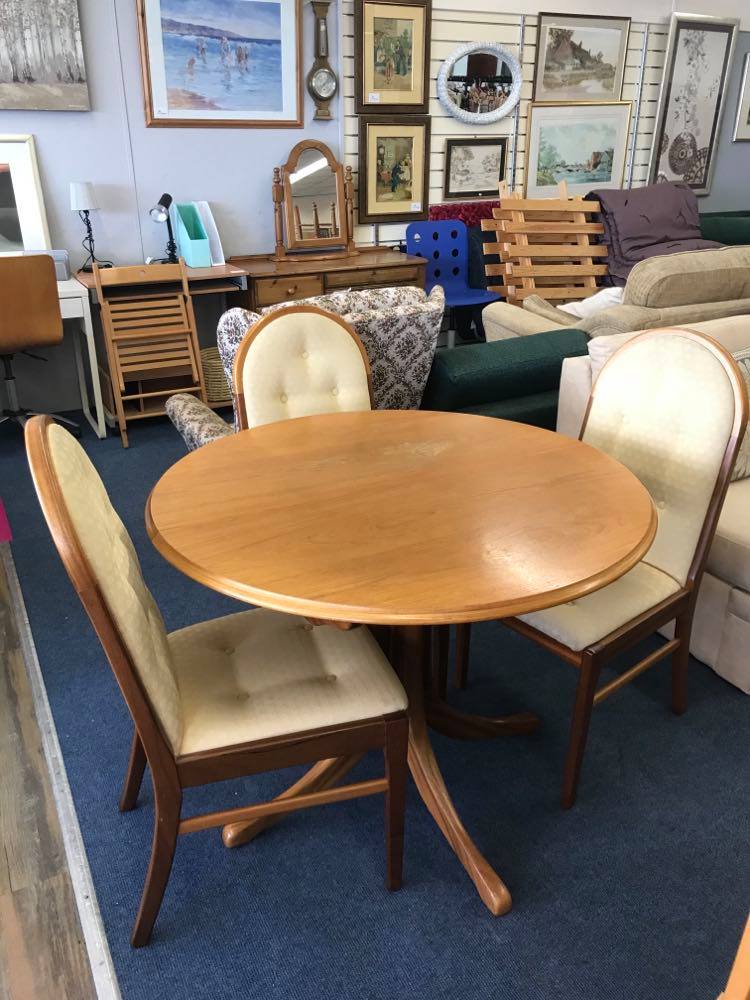 Extendable circular dining table and 4 upholstered chairs, purchased new from Sutcliffe furniture in 2004 for £1609 (!). Table extends with a butterfly mechanism in the middle.