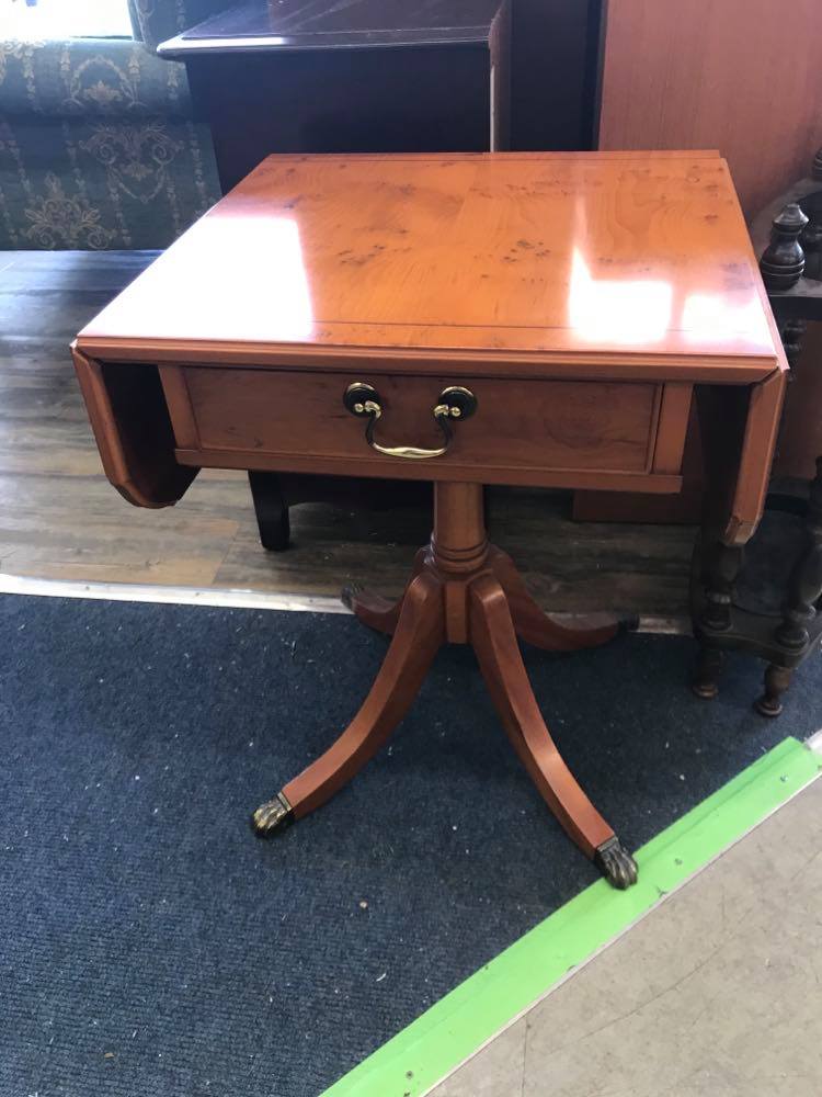 Drop leaf side table with a drawer.