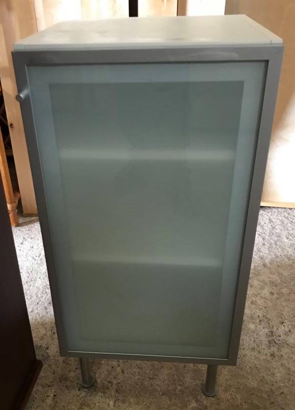 Ikea Vättern bathroom cabinet with reversible door & 2 shelves, on 4 chrome adjustable legs. We have 2 of these available.