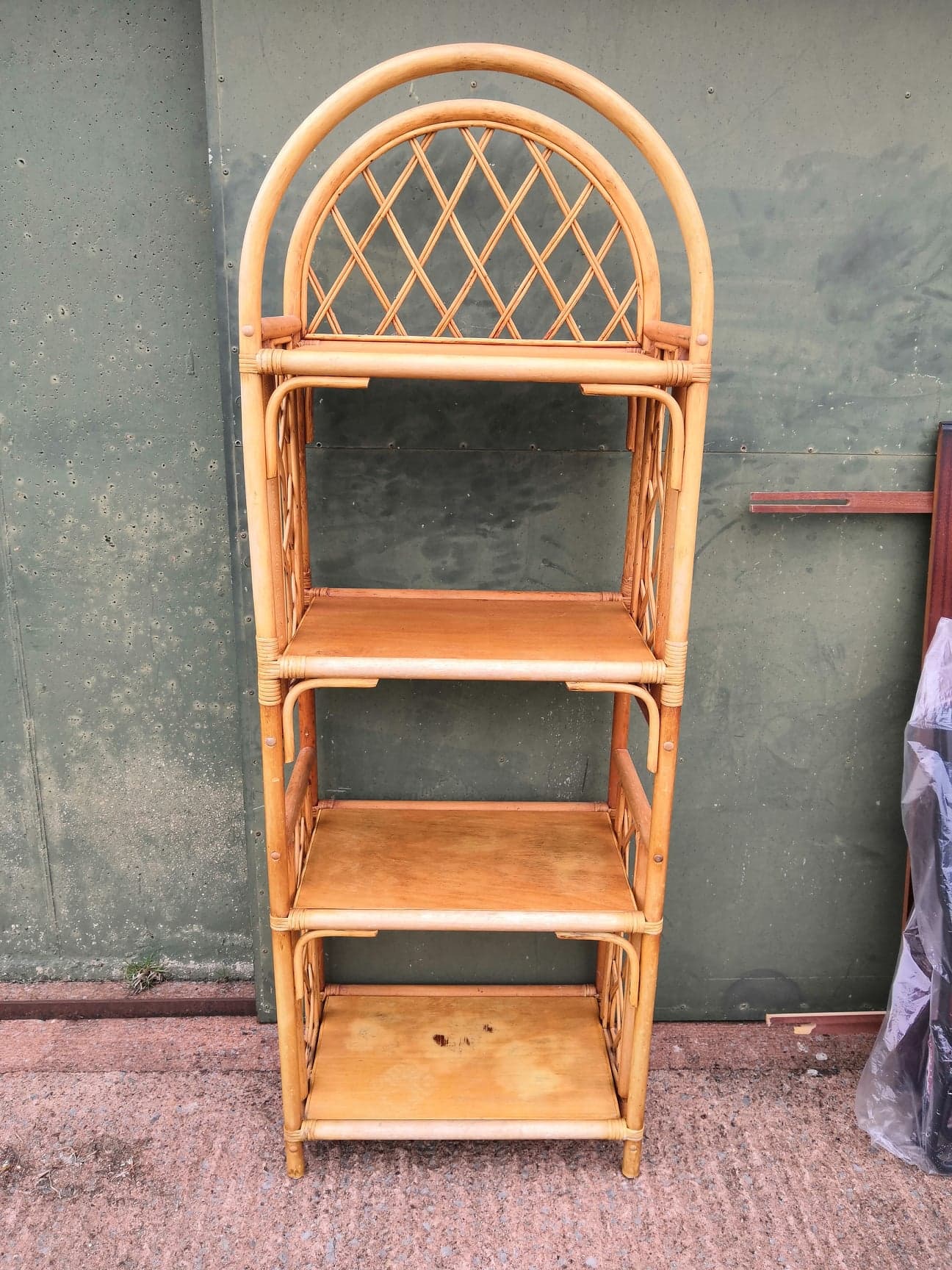 Bent Bamboo shelving unit with plywood shelves.