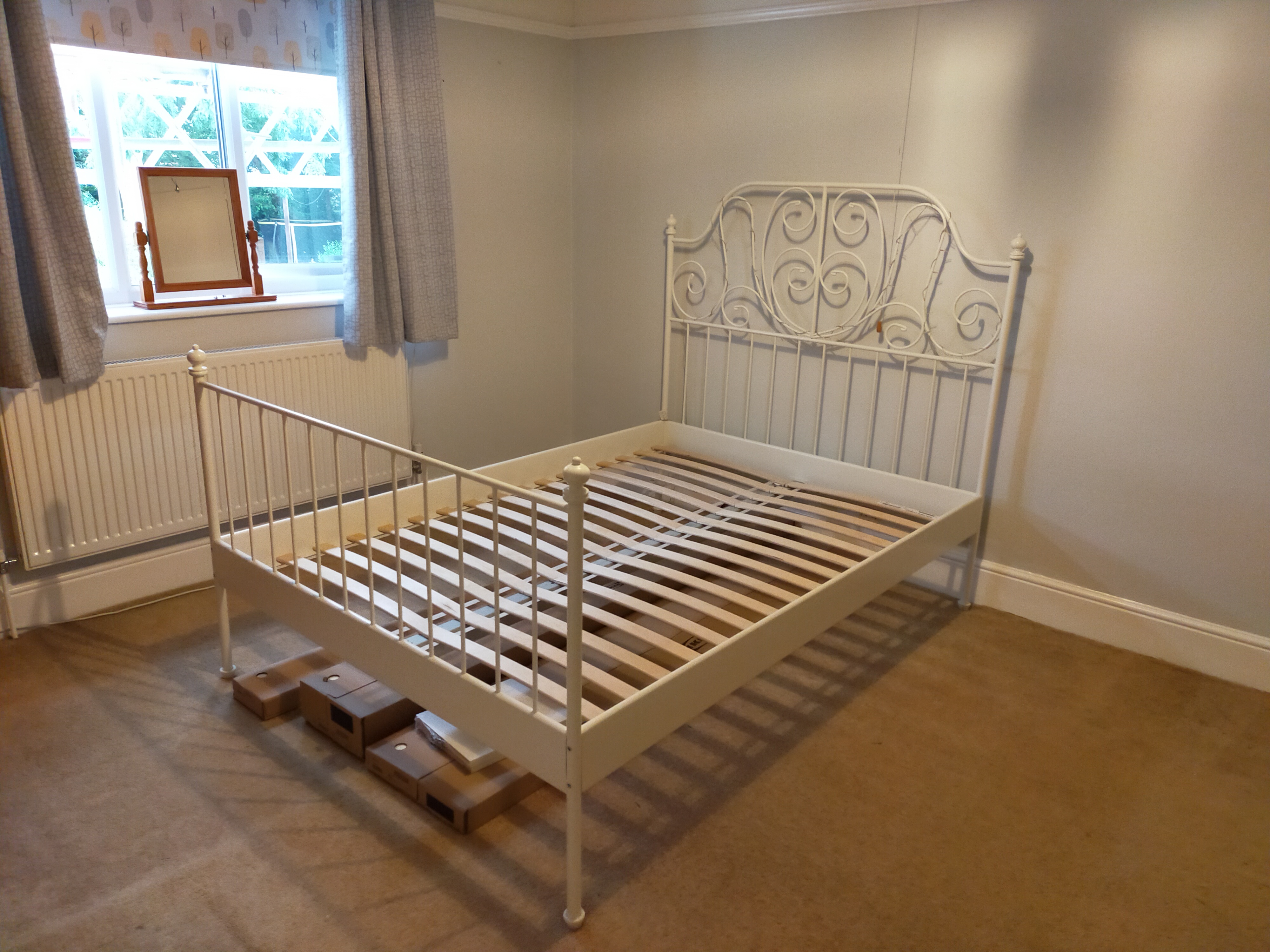 Pretty, double cream metal IKEA bedframe with slatted wooden base