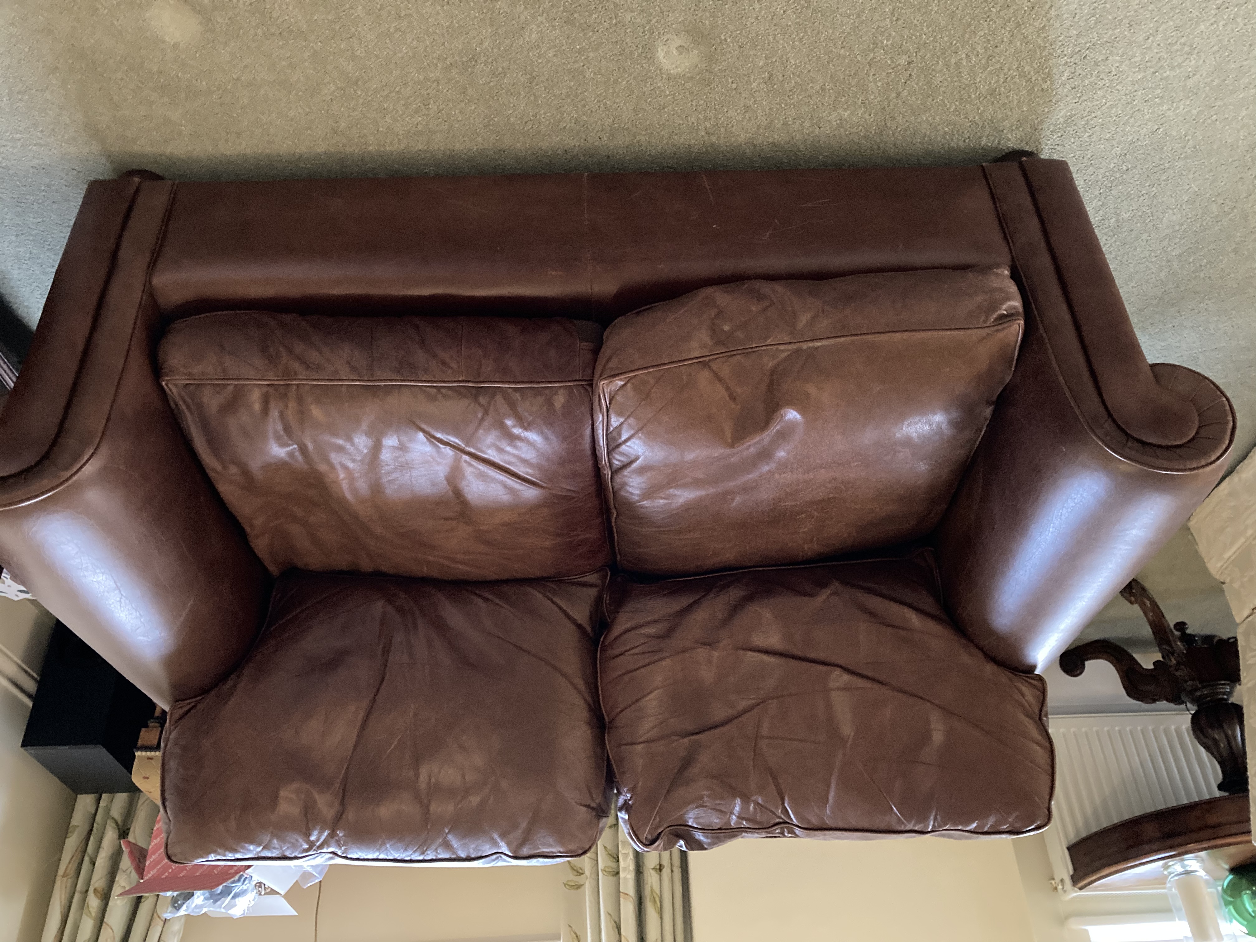 Laura Ashley 2 seat brown leather sofa. Back and top of cushions slightly faded due to sun but otherwise in excellent order. 
Measurements: 160 x 90 x 85 cm (w x d x h)