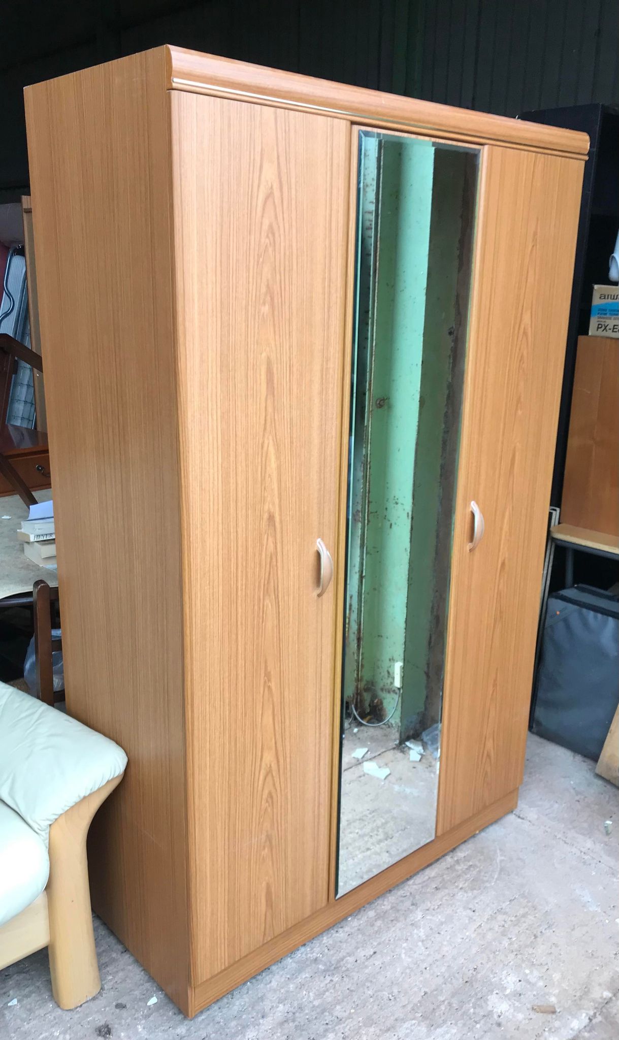 Large two-door wardrobe with fixed mirror in the middle. On wheels so easy to move around the room. 
Dimensions: 114cm wide, 52cm deep, 185cm tall.
Due to size this cannot be delivered to upstairs rooms., matching dressing table and small chest of drawers are also available.
