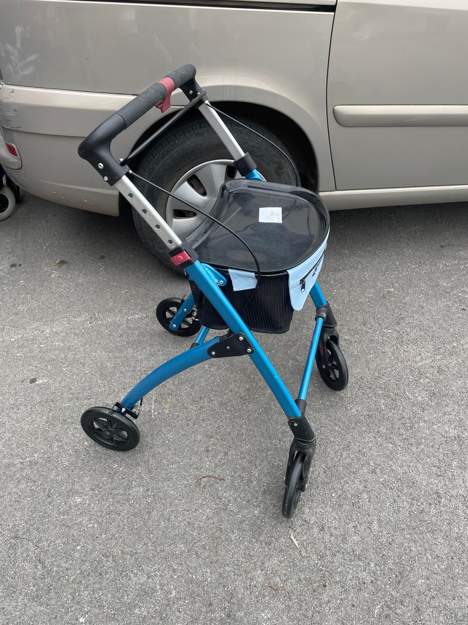4 Wheeled folding walker with seat and shopping bag